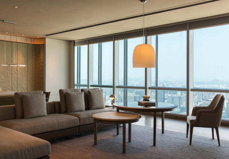 How does the furniture design of hotel chains take into account both practicality and durability?